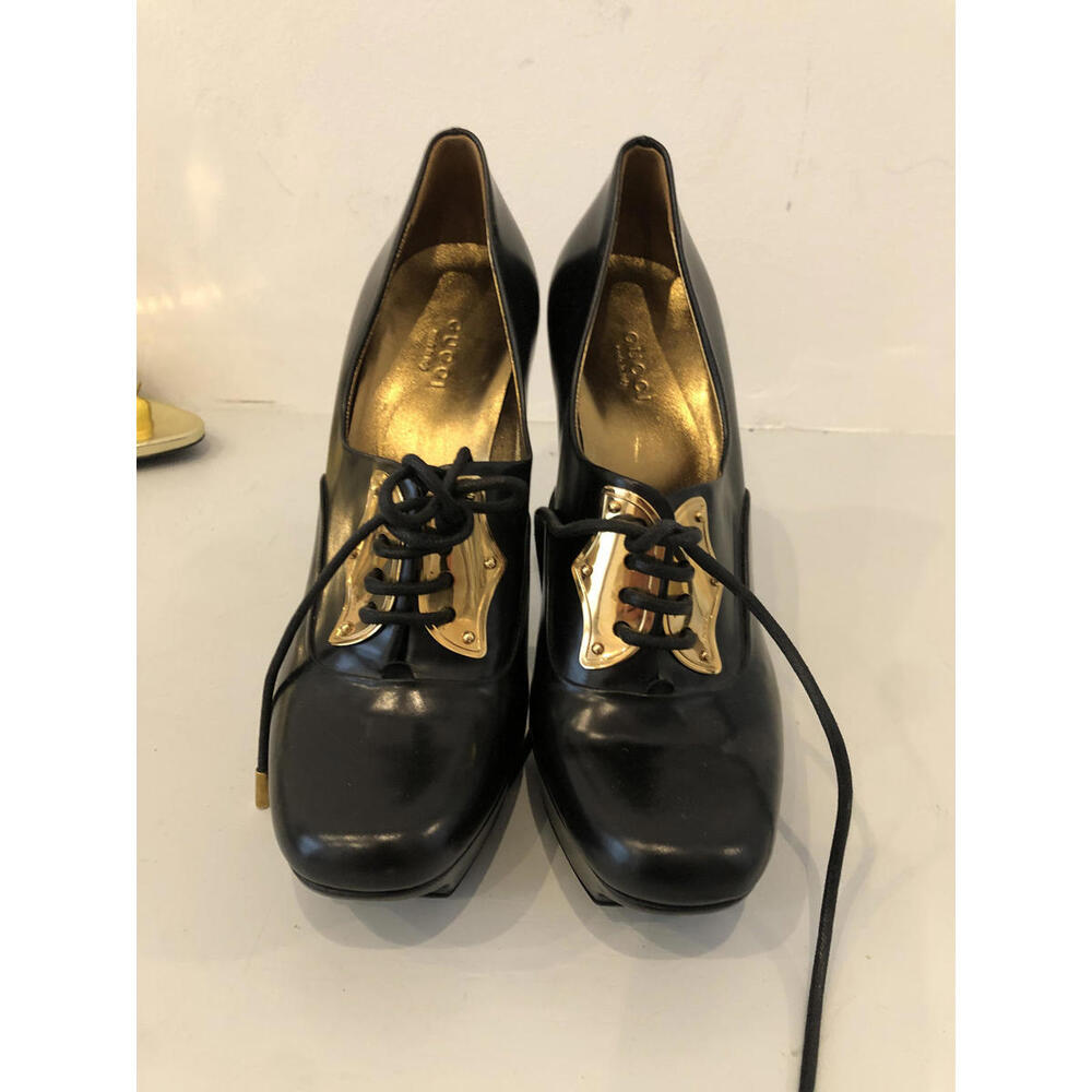 Stylish Black Platform Heels with Gold Accents